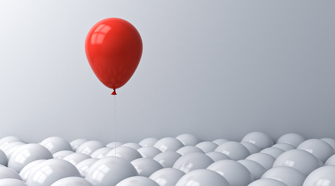 One red balloon pop out from the white balloons Stand out from the crowd different concept or think outside the box creative idea concept